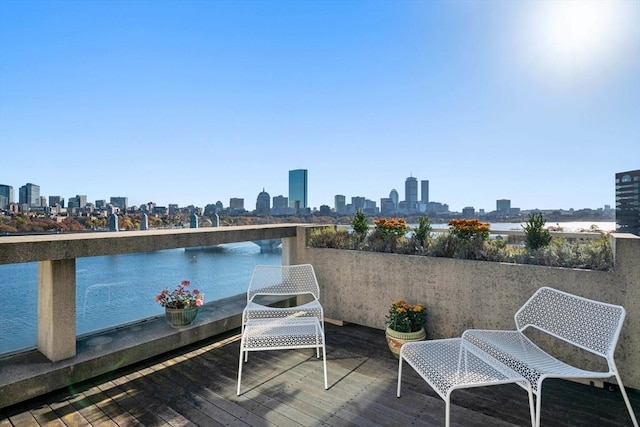 75-83 Cambridge Pkwy Unit W1009, Cambridge, MA 02142 - wooden deck featuring a view of skyline and a water view