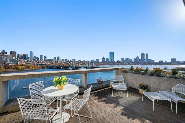 wooden terrace with a water view