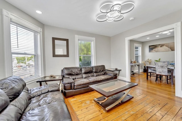 6-8 Carlton, Lynn, MA 01902 - living room with light wood finished floors, a chandelier, and baseboards