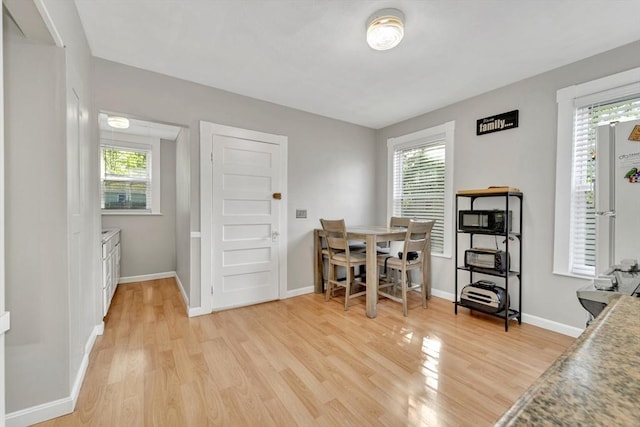 6-8 Carlton, Lynn, MA 01902 - dining room with light wood-style floors, baseboards, and plenty of natural light