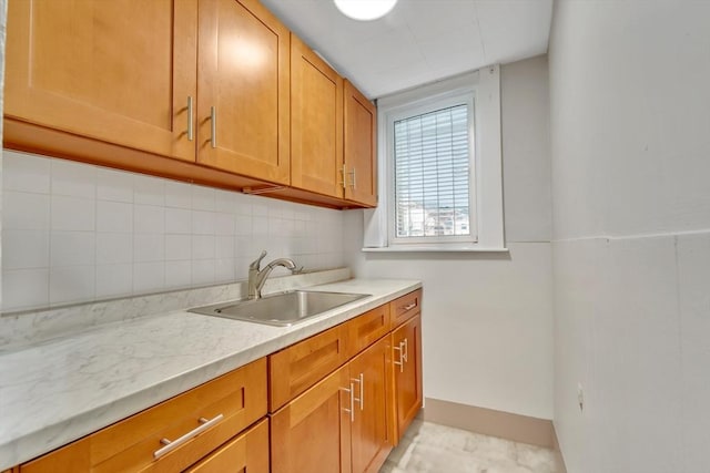 6-8 Carlton, Lynn, MA 01902 - kitchen featuring a sink, backsplash, and brown cabinets