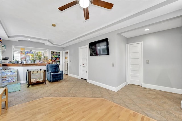 6-8 Carlton, Lynn, MA 01902 - sitting room with recessed lighting, a ceiling fan, a tray ceiling, baseboards, and tile patterned floors