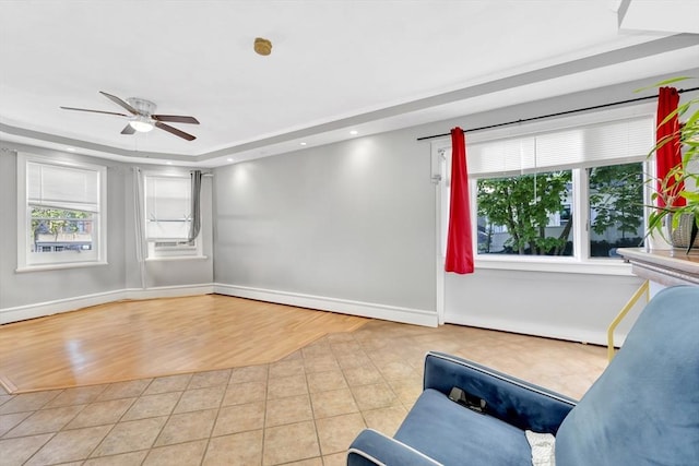 6-8 Carlton, Lynn, MA 01902 - living area featuring tile patterned flooring, healthy amount of natural light, ceiling fan, and baseboards