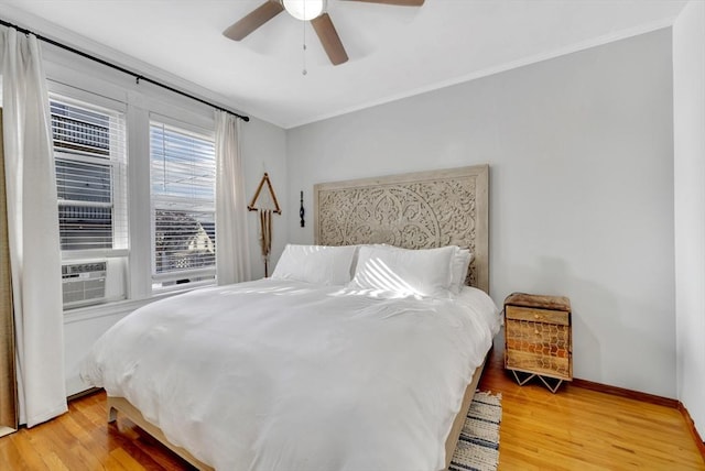 6-8 Carlton, Lynn, MA 01902 - bedroom with light wood-style flooring, baseboards, ornamental molding, and ceiling fan