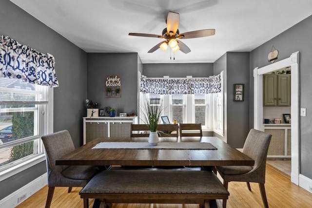 77 Shawmut Ave, New Bedford, MA 02740 - dining space with a ceiling fan, baseboards, and light wood finished floors