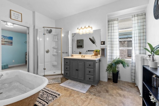 77 Shawmut Ave, New Bedford, MA 02740 - full bathroom featuring vanity, a freestanding tub, and a shower stall