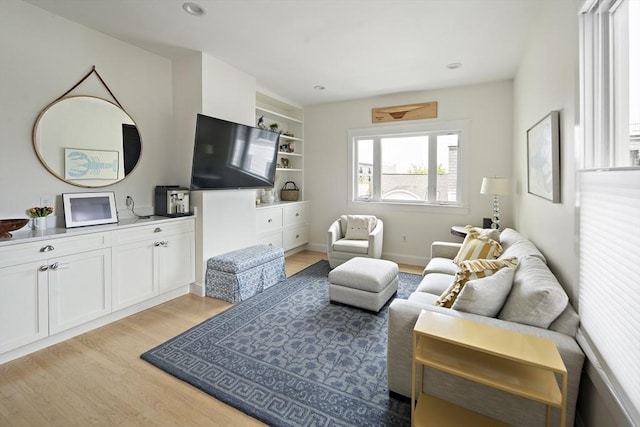414 Sumner St Unit 1, Boston, MA 02128 - living area with light wood finished floors, built in features, and recessed lighting