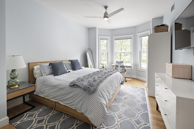 414 Sumner St Unit 1, Boston, MA 02128 - bedroom featuring light wood finished floors, baseboards, and a ceiling fan