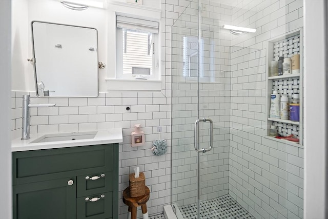 414 Sumner St Unit 1, Boston, MA 02128 - full bathroom with a shower stall, vanity, and tile walls