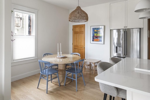 414 Sumner St Unit 1, Boston, MA 02128 - dining room featuring light wood-style floors, plenty of natural light, and baseboards