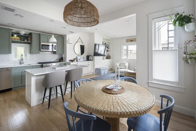 414 Sumner St Unit 1, Boston, MA 02128 - dining room featuring light wood-type flooring, recessed lighting, and baseboards