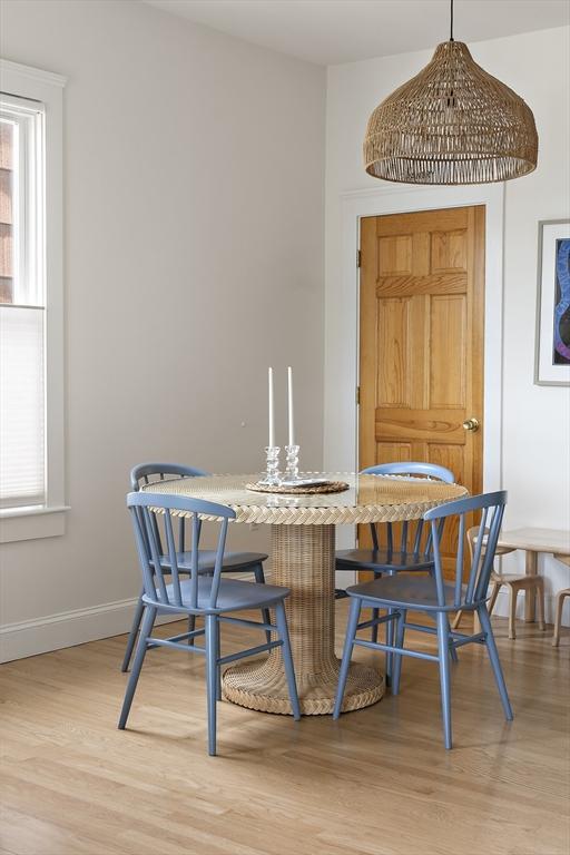 414 Sumner St Unit 1, Boston, MA 02128 - dining area with light wood finished floors and baseboards