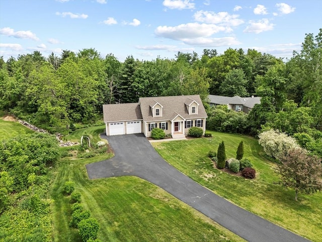 43 Julian Dr, Leominster, MA 01453 - cape cod home featuring a garage, asphalt driveway, a front lawn, a forest view, and roof with shingles