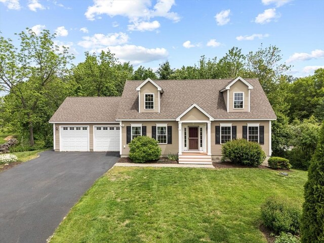 43 Julian Dr, Leominster, MA 01453 - cape cod-style house featuring driveway, a garage, a front yard, and roof with shingles