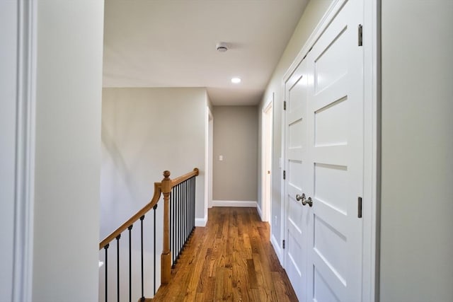 526 Old Warren Rd, Swansea, MA 02777 - hallway featuring wood finished floors, an upstairs landing, and recessed lighting