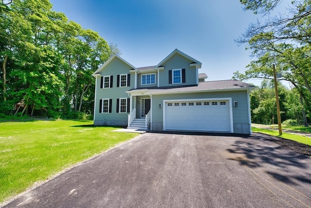 526 Old Warren Rd, Swansea, MA 02777 - view of front facade with driveway and a front lawn