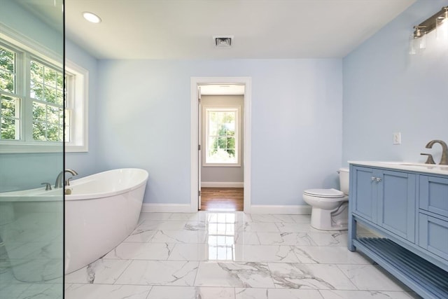 526 Old Warren Rd, Swansea, MA 02777 - bathroom with a freestanding tub, marble finish floors, vanity, and recessed lighting