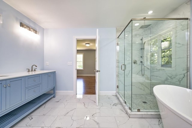 526 Old Warren Rd, Swansea, MA 02777 - full bath featuring a freestanding bath, a marble finish shower, marble look tiles, double vanity, and recessed lighting