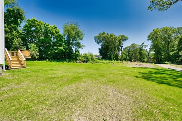 526 Old Warren Rd, Swansea, MA 02777 - view of grassy yard with stairs and a deck