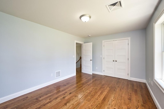 526 Old Warren Rd, Swansea, MA 02777 - unfurnished bedroom with wood finished floors and a closet