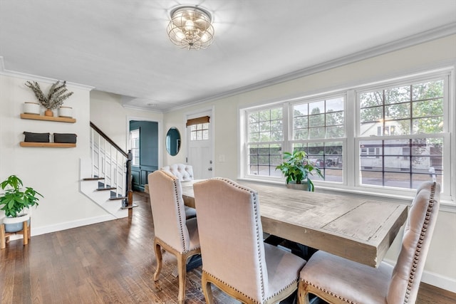 dining area with dark hardwood / wood-style floors and crown molding