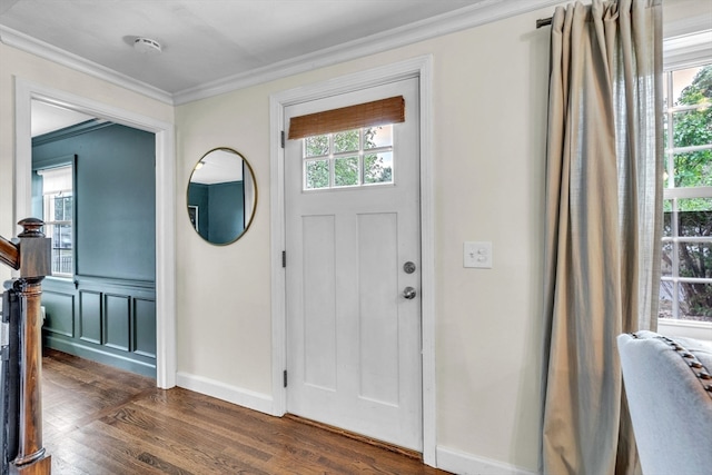 entryway featuring crown molding and dark wood-type flooring