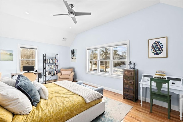bedroom featuring ceiling fan, baseboards, wood finished floors, lofted ceiling, and visible vents