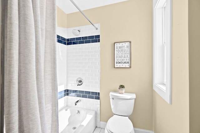 full bath with baseboards, tile patterned flooring, toilet, and shower / tub combo with curtain