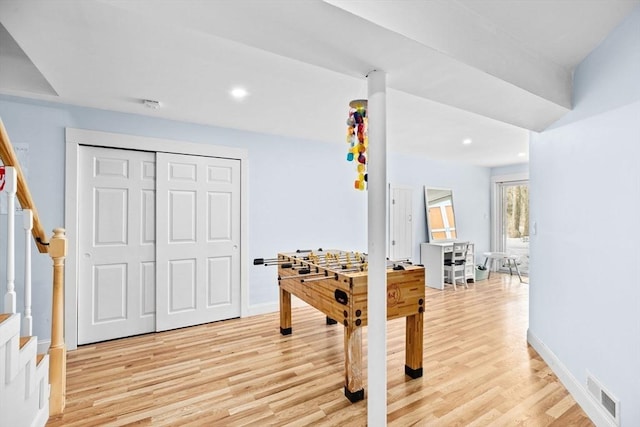 recreation room with recessed lighting, visible vents, and light wood finished floors