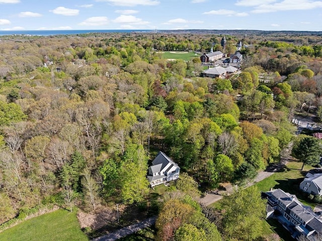 bird's eye view featuring a wooded view