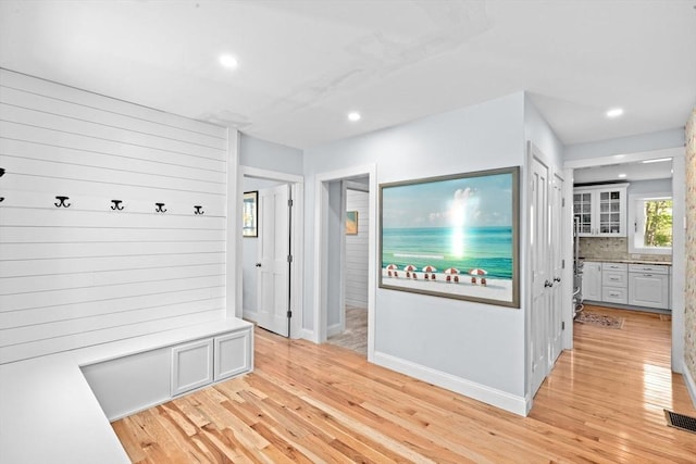 mudroom featuring recessed lighting, light wood-style flooring, baseboards, and visible vents