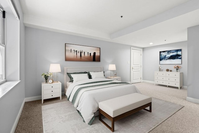 bedroom featuring light colored carpet