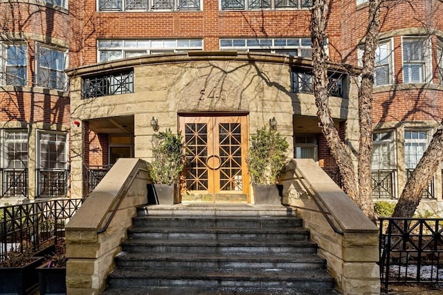 property entrance featuring french doors