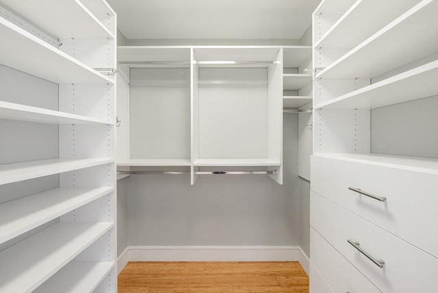 45 Province St Unit 1103, Boston, MA 02108 - walk in closet with light wood finished floors