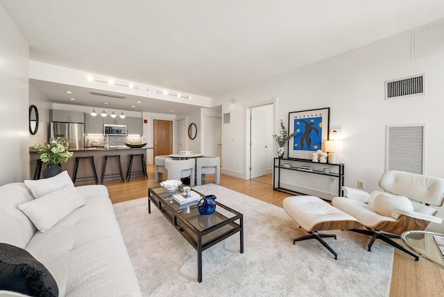 45 Province St Unit 1103, Boston, MA 02108 - living area featuring light wood-style flooring and baseboards