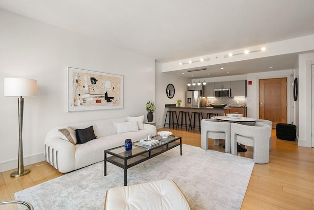 45 Province St Unit 1103, Boston, MA 02108 - living area with light wood-type flooring, baseboards, and recessed lighting