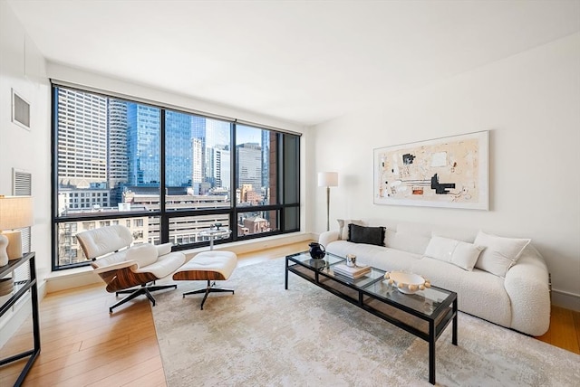 45 Province St Unit 1103, Boston, MA 02108 - living room featuring wood finished floors and floor to ceiling windows