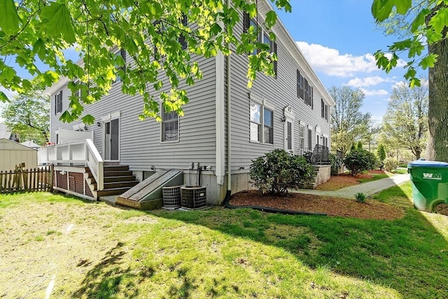 rear view of property with a wooden deck