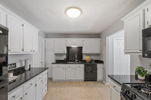 kitchen with black appliances, a sink, white cabinets, and a textured ceiling