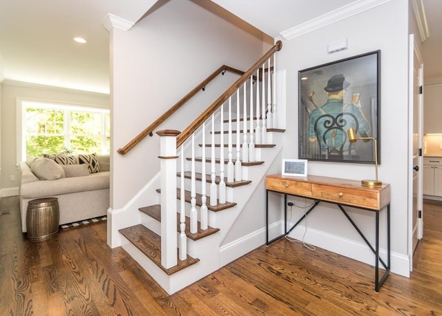staircase featuring crown molding, wood finished floors, baseboards, and recessed lighting