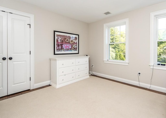 bedroom with baseboards and a closet