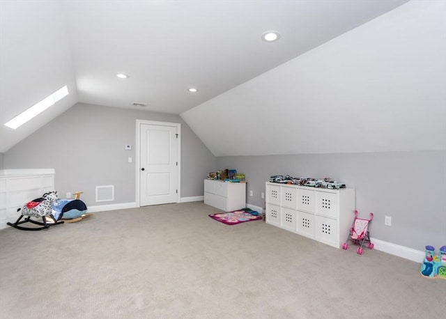 playroom featuring vaulted ceiling, carpet floors, a skylight, recessed lighting, and baseboards