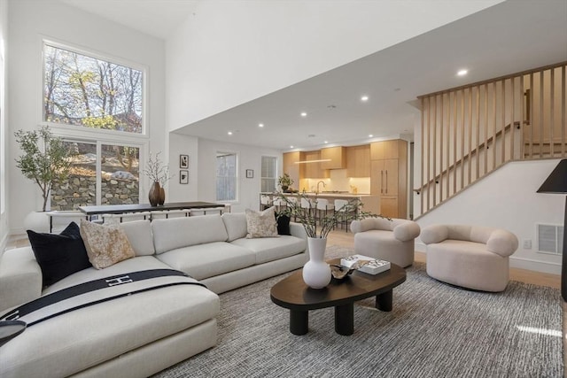 44 Robeson St Unit 44B, Boston, MA 02130 - living area featuring stairway, recessed lighting, a high ceiling, and baseboards