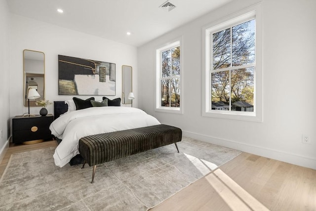 44 Robeson St Unit 44B, Boston, MA 02130 - bedroom with multiple windows, baseboards, wood finished floors, and recessed lighting