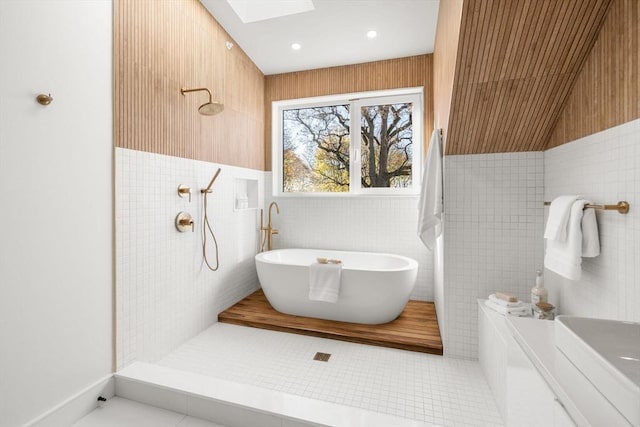 44 Robeson St Unit 44B, Boston, MA 02130 - full bath featuring a skylight, a freestanding bath, tile walls, a tile shower, and tile patterned floors