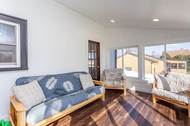 sunroom / solarium featuring vaulted ceiling