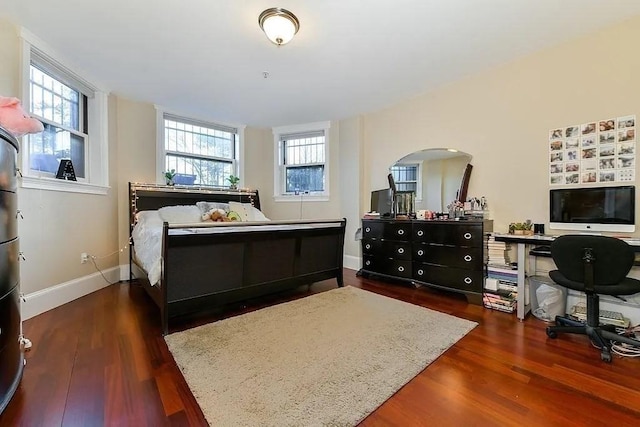 19 Bay State Rd Unit 1, Boston, MA 02215 - bedroom with arched walkways, wood finished floors, baseboards, and an office area