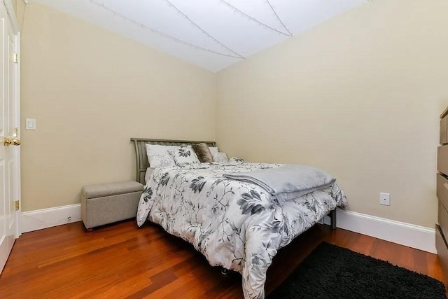 19 Bay State Rd Unit 1, Boston, MA 02215 - bedroom with lofted ceiling, wood finished floors, and baseboards