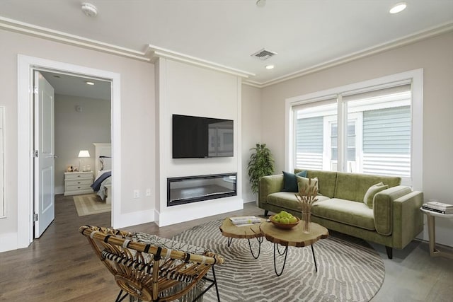 living room with crown molding and dark hardwood / wood-style floors