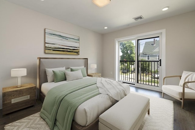 bedroom featuring hardwood / wood-style floors and access to exterior